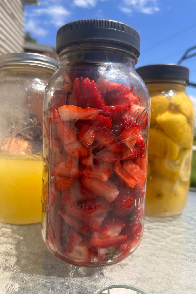 strawberries and lemon juice prepared to make strawberry lemonade concentrate