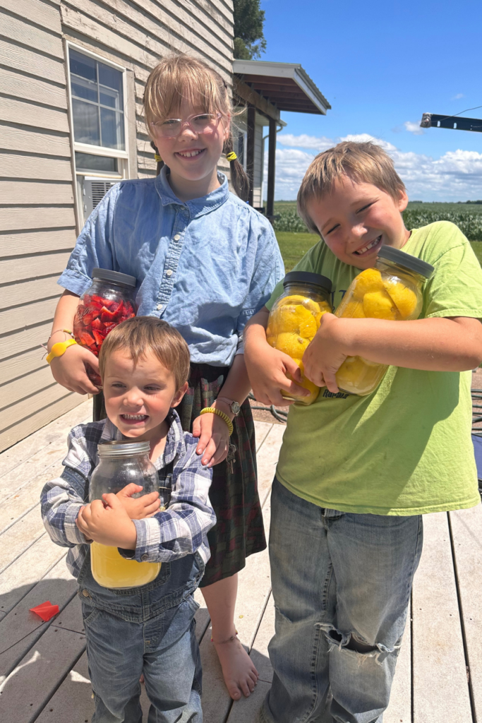 Kids so excited to have their hand squeezed lemon juice, lemon peels in vinegar and chopped strawberries