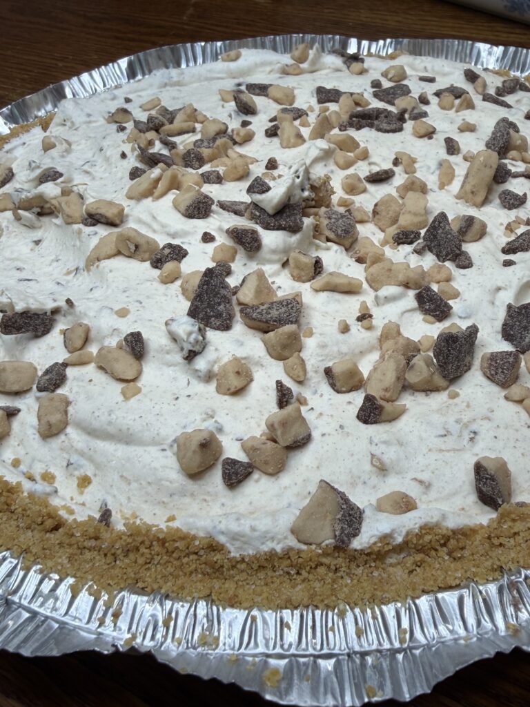 close up of crumbled heath bar topping on a heath bar cool whip pie